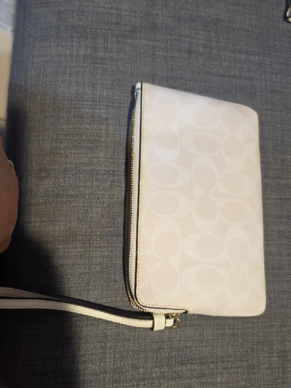Coach wristlet featuring